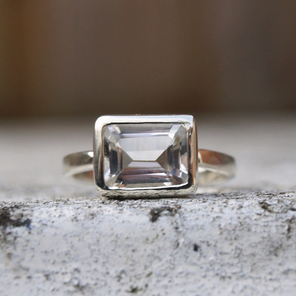 9ct recycled white gold ring with a white topaz