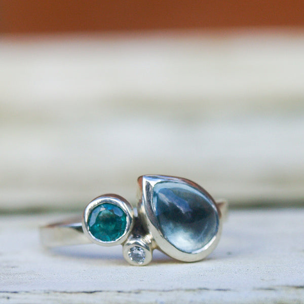 Aquamarine, emerald and diamond ring in recycled 9ct white gold