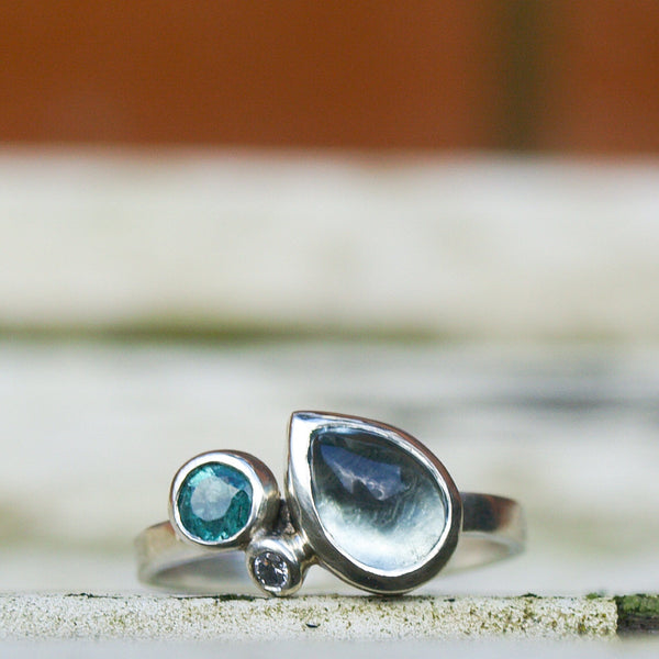 Aquamarine, emerald and diamond ring in recycled 9ct white gold