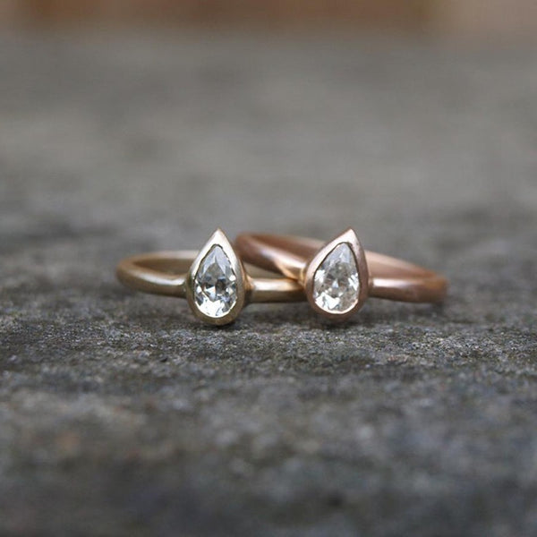 Pear shaped moissanite ring in recycled gold