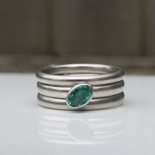 Platinum ring set with emerald or sapphire