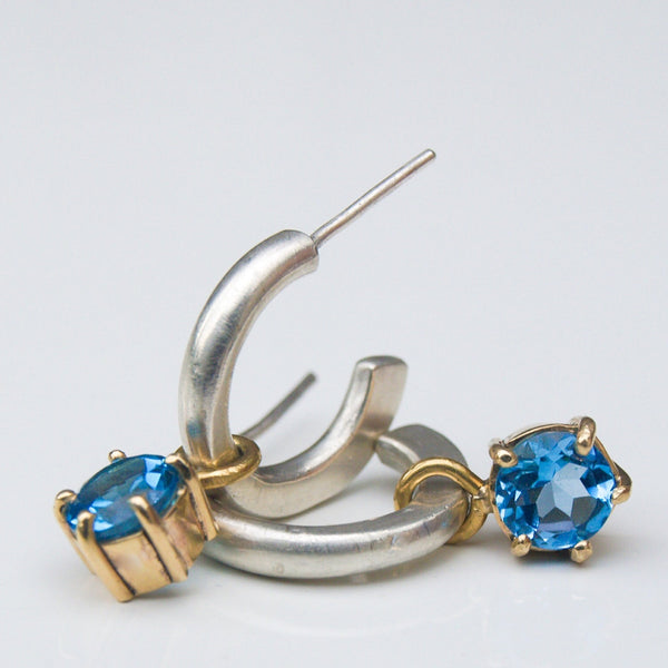 Silver and gold blue topaz hoop earrings