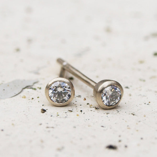 Tiny white gold diamond stud earrings