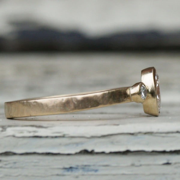 Recycled gold diamond trilogy engagement ring