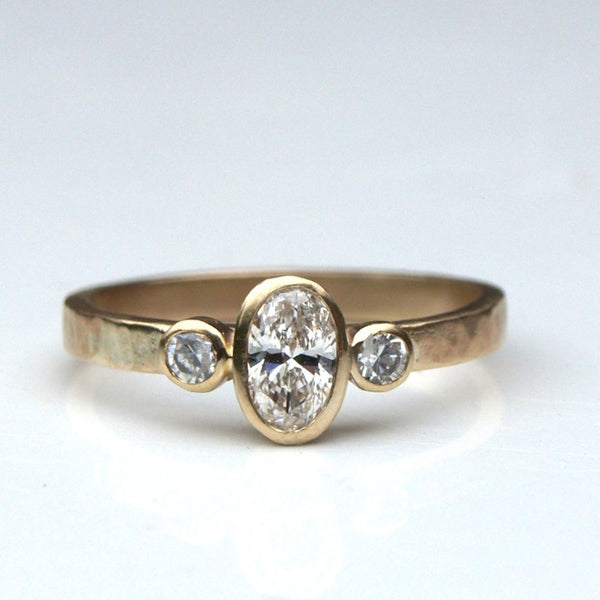 Recycled gold diamond trilogy engagement ring