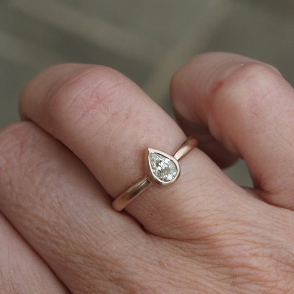 Pear shaped moissanite ring in recycled gold