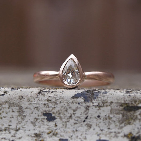 Pear shaped moissanite ring in recycled gold