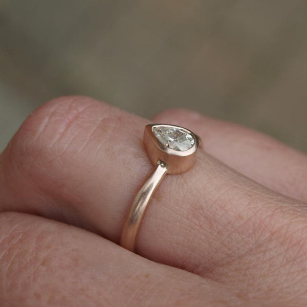 Pear shaped moissanite ring in recycled gold