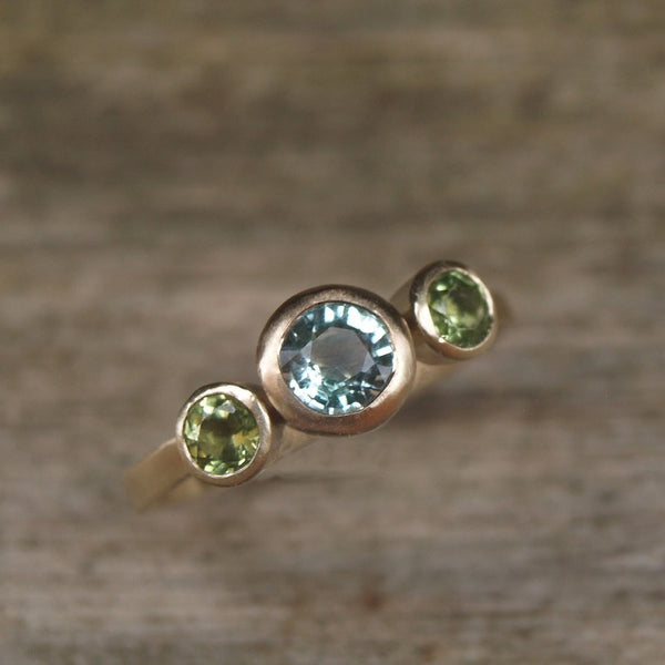 Green beryl and peridot trilogy ring