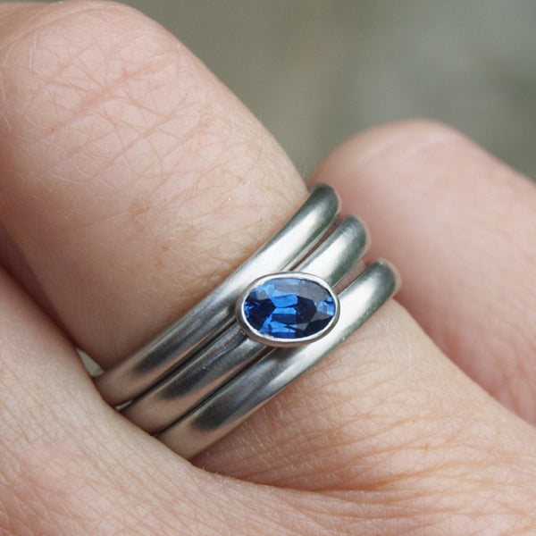 Platinum ring set with emerald or sapphire