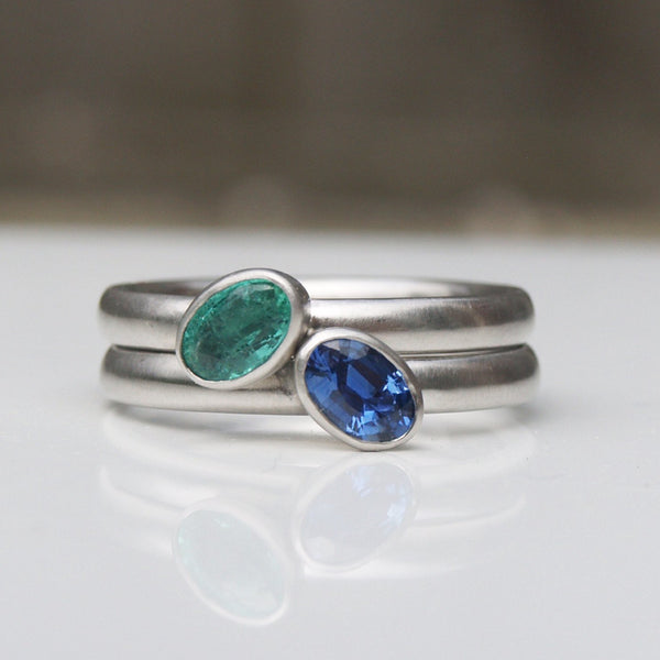 Platinum ring set with emerald or sapphire