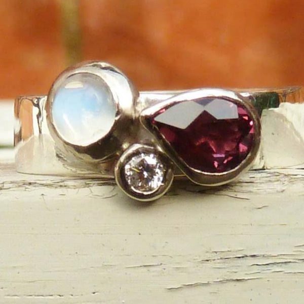 Silver garnet, moonstone and diamond ring