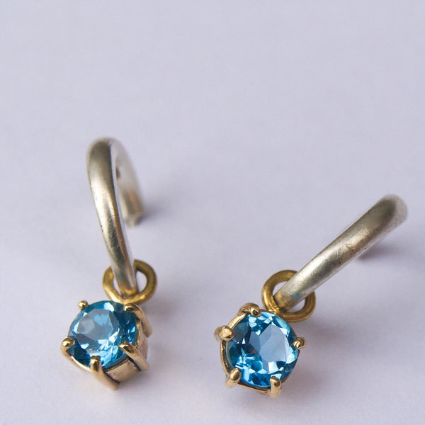 Silver and gold blue topaz hoop earrings