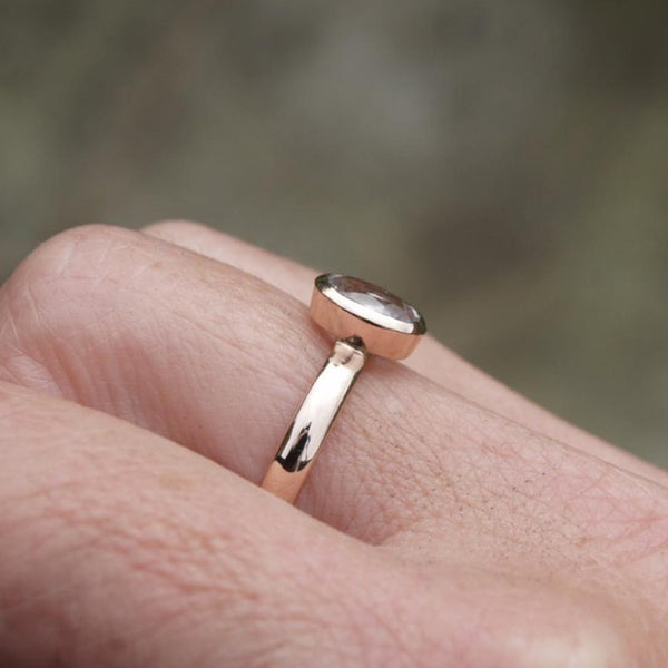 Rose gold ring with oval white sapphire