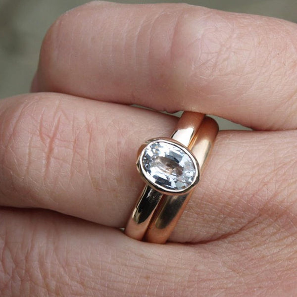 Rose gold ring with oval white sapphire