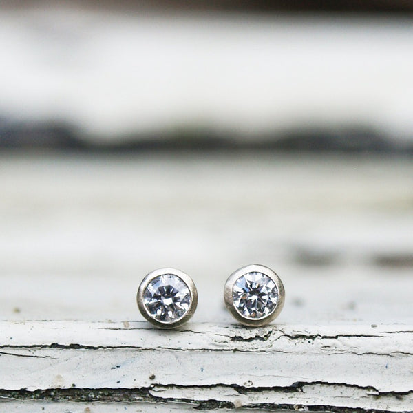 Tiny white gold diamond stud earrings