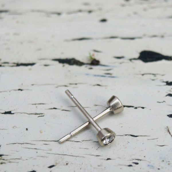 Tiny white gold diamond stud earrings